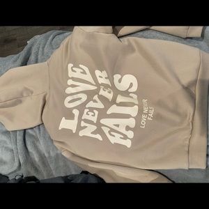 love never fails hoodie